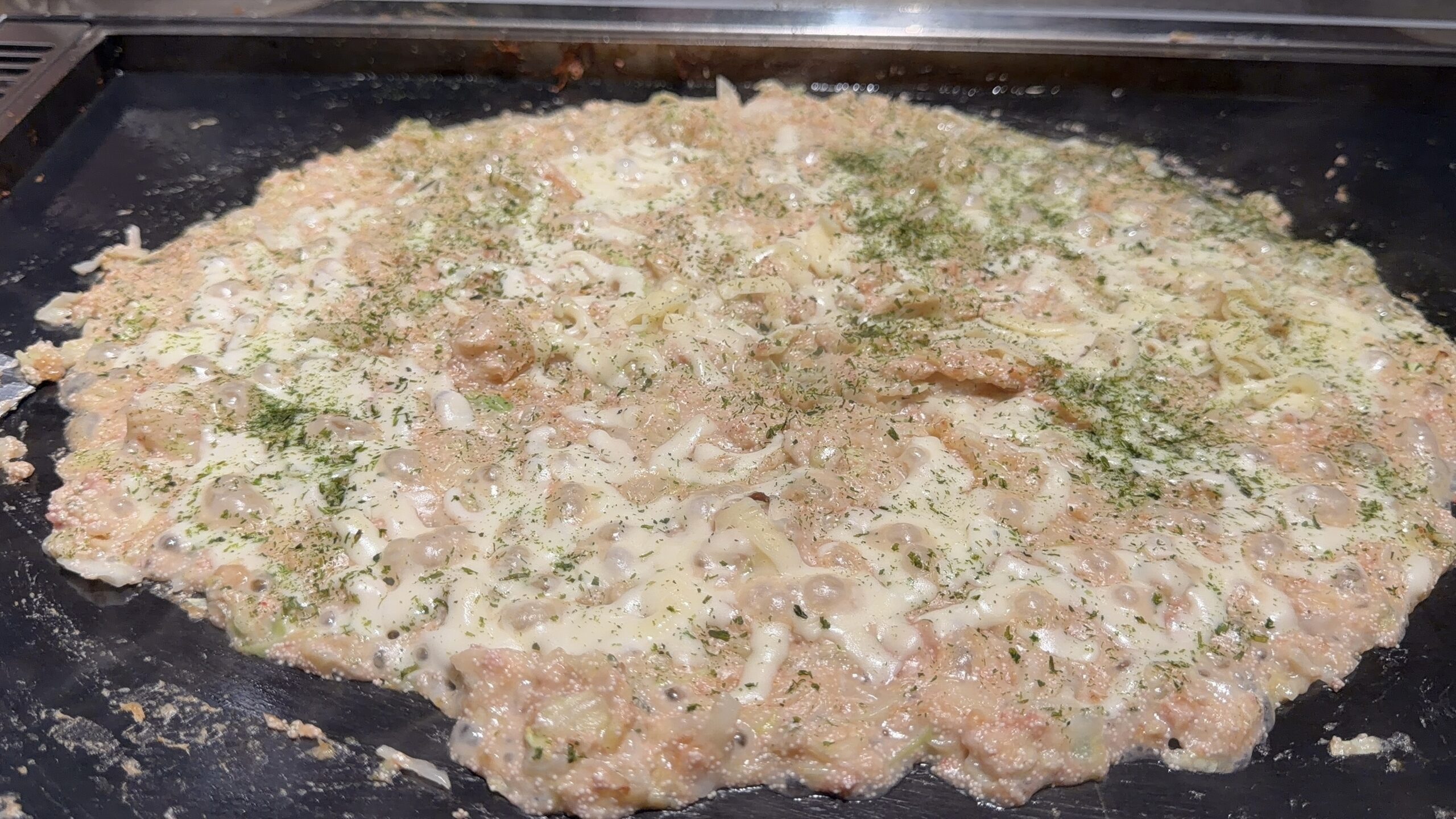月島もんじゃ おこげ 仙台クリスロードの明太子もちもんじゃチーズトッピング